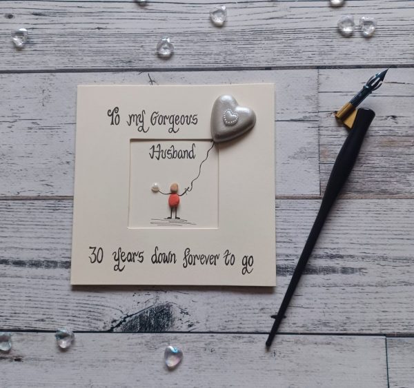 30th wedding card for husband, pebble art pearl card with pearl coloured pebble heart. Handwritten in black ink, To my gorgeous husband, 30 years down forever to go. Created on cream card.